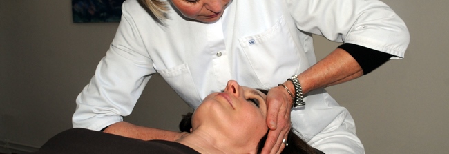 Chiropractor massaging head